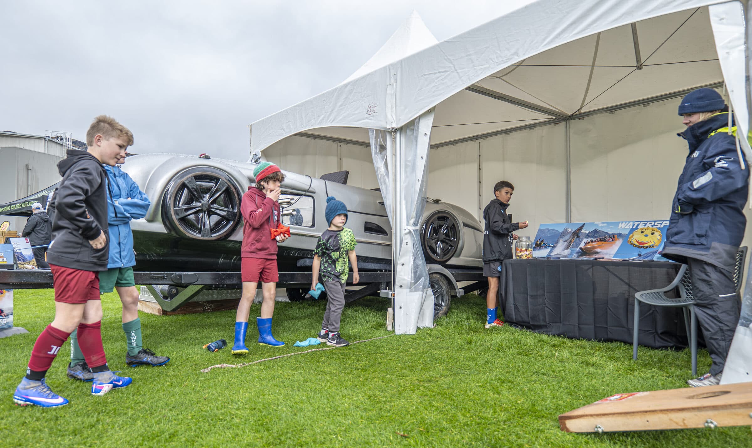 Children exploring the event village marquee between games